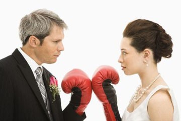 Husband and wife ready for boxing fight match.